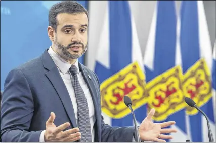  ?? DARREN CALABRESE – THE CANADIAN PRESS ?? Nova Scotia Education Minister Zach Churchill speaks during a press conference in Halifax on Wednesday. Churchill says the government will move ahead with a recommenda­tion to eliminate all of the province’s seven English language regional school boards.