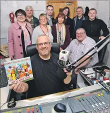  ??  ?? The board with David Ogg on his last day at Nevis Radio.