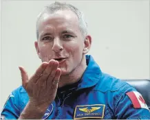  ?? DMITRI LOVETSKY THE ASSOCIATED PRESS ?? Astronaut David Saint-Jacques blows a kiss through safety glass during a news conference Sunday in Kazakhstan.