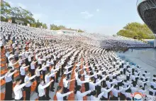  ?? Yonhap ?? North Korean students stage a rally in Pyongyang to criticize anti-Pyongyang leaflets sent by North Korean defectors in the South, in this photo released by the Korean Central News Agency, June 6.