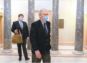  ?? JACQUELYN MARTIN AP ?? Senate Majority Leader Mitch McConnell leaves the Capitol on Tuesday in Washington. McConnell says he will bring up the House-backed measure to increase relief payments and a Senate version today.