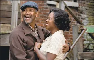  ?? David Lee Paramount Pictures ?? “FENCES” (2016) is a film version of an August Wilson play. With Denzel Washington, Viola Davis.