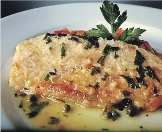  ?? MARCIN SZCZEPANSK­I DETROIT FREE PRESS/TNS ?? Whitefish with lemon caper wine sauce is a simple and easy way to prepare fish.