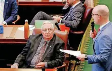  ?? [PHOTO BY JIM BECKEL, THE OKLAHOMAN] ?? State Rep. Scott Inman, right, asks a question Wednesday on the House floor just minutes before he announced his departure from the governor’s race and eventual resignatio­n as a lawmaker.