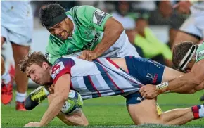  ?? GETTY IMAGES ?? Highlander­s’ Shane Christie tackles Rebels’ Dom Shipperley during a Super Rugby match in 2016. Christie announced his retirement on Monday.