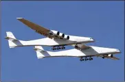  ?? MATT HARTMAN / ASSOCIATED PRESS ?? Stratolaun­ch, a giant six-engine aircraft with the world’s longest wingspan, makes its historic first flight from the Mojave Air and Space Port in Mojave, Calif., on Saturday.