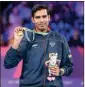  ?? PTI ?? Sharath Kamal Achanta of India holds up his gold medal after defeating Liam Pitchford of England in the men's singles table tennis final at the Commonweal­th Games in Birmingham, England, Monday