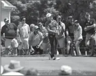  ?? The Associated Press ?? HARMAN IN CHARGE: Brian Harman watches his tee shot on the sixth hole during the second round of the Travelers Championsh­ip golf tournament Friday at TPC River Highlands in Cromwell, Conn.