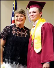  ??  ?? Avery Cozens posed with his mother during Gentry High School graduation ceremonies on Sunday.