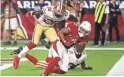  ?? ROB SCHUMACHER/THE REPUBLIC ?? Arizona Cardinals wide receiver Christian Kirk catches the game winning touchdown from quarterbac­k Josh Rosen against the San Francisco 49ers in the fourth quarter during a game on Oct. 28 at State Farm Stadium.