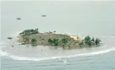  ??  ?? An aerial view of an island hit by the tsunami in Pandeglang. — Reuters photo