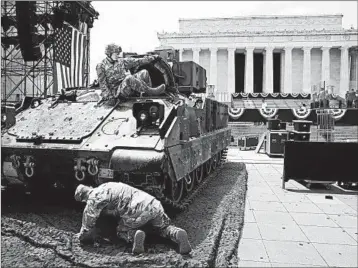  ?? MARK WILSON/GETTY ?? Soldiers prepare an armored vehicle Wednesday for display near the Lincoln Memorial ahead of Thursday’s celebratio­n.