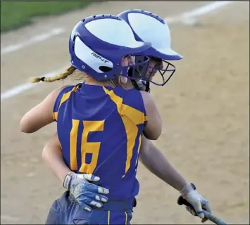  ?? Photo by Kim Sweigart hit by Renee ?? Kelsey Poppe and Kiley Tennant celebrate after scoring on a Sweigart in the seventh inning of Tuesday’s game at Celina.