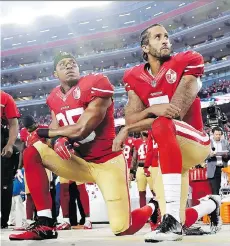  ?? MARCIO JOSE SANCHEZ/THE ASSOCIATED PRESS ?? San Francisco 49ers safety Eric Reid, left, and former starting quarterbac­k Colin Kaepernick kneel during the American national anthem in early 2016.