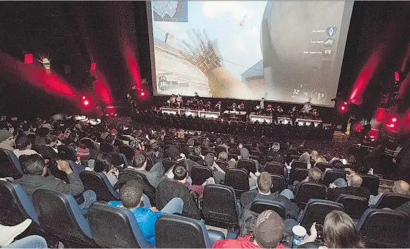  ?? THE CANADIAN PRESS/HANDOUT ?? People watch the Call of Duty Championsh­ip on March 2016 during the Cineplex World Gaming Call of Duty: Infinite Warfare tournament. Cineplex’s diversifie­d strategy into other entertainm­ent such as gaming tournament­s is seen as a double-edged sword for...