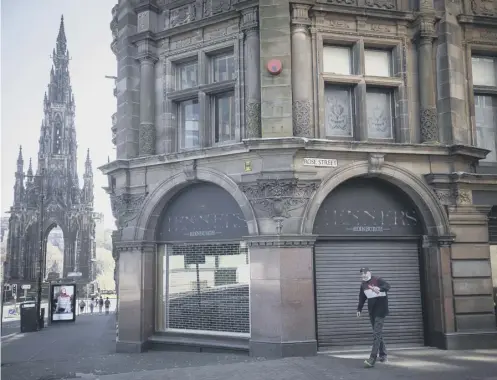  ??  ?? 0 Mike Ashley has been ordered to reinstate the Jenners signs after they were removed from the store on Princes Street, Edinburgh