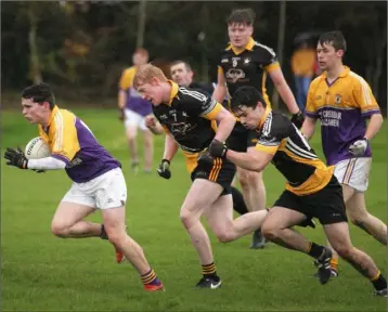  ??  ?? Ciarán Murphy of St. Patrick’s takes off with Réalt na Mara’s Patrick Fleming and Michael Burke in pursuit.