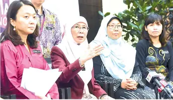  ??  ?? Wan Azizah (second, left) at a media conference after the launching of the National Strategic Plan to Address the Causes of Underage Marriage yesterday. - Bernama photo