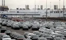  ?? AP FILE ?? MOTOWN IN MOTION: Jeeps are parked outside the Jefferson North Assembly Plant in Detroit. Fiat Chrysler can move forward with plans to build a new, $1.6 million assembly plant in Detroit and invest $900 million to retool and modernize another.