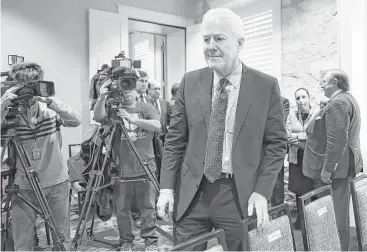 ?? John Davenport / San Antonio Express-News ?? U.S. Sen. John Cornyn arrives Monday for a NAFTA field hearing in San Antonio, where many business leaders spoke out against withdrawal from the trade agreement that is currently being renegotiat­ed.