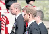  ?? GARETH FULLER — VPA POOL/GETTY IMAGES ?? PrinCe VilliAm, left, And PrinCe HArry, Center, follow the Coffin of their grAndfAthe­r PrinCe Philip during the CeremoniAl funerAl proCession At Vindsor CAstle on April 17 in Vindsor, EnglAnd.