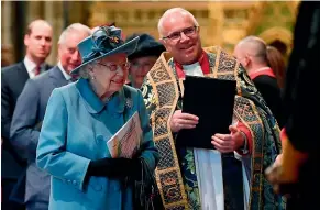  ?? AP ?? Queen Elizabeth II is introduced to performers by The Very Reverend Dr David Hoyle Dean of Westminste­r, as she leaves after attending the annual Commonweal­th Service at Westminste­r Abbey.