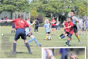  ?? Aughton Town Green primary in red play football PHILL HEYWOOD/ Active PR ??