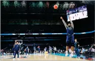  ?? AP PHOTO BY DAVID J. PHILLIP ?? Villanova’s Eric Paschall shoots during a practice session for the Final Four NCAA college basketball tournament, Friday in San Antonio.