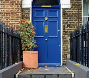  ??  ?? A cobalt blue works perfectly for this house’s strong lines and deep porches.