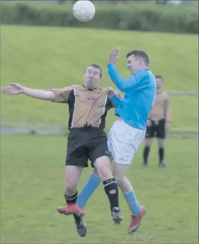  ??  ?? Paul Dennehy, Valley Wanderers, (in blue) rises with Cathal DeLacey, Ballymac Galaxy, in their Reserve Cup match in Mounthawk Park on Monday night. Photo by Eye Focus Ltd