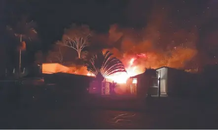  ??  ?? A fire rips through a Runaway Bay home on Deagon St on Thursday night.