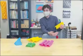  ?? ZACHARY SRNIS — THE MORNING JOURNAL ?? James Peake, owner of Foldspace Origami Studio, teaches origami at the studio and has recently added virtual instructio­n.