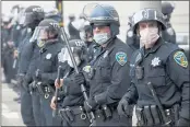  ?? JOSE CARLOS FAJARDO — BAY AREA NEWS GROUP FILE ?? Police create a blockade as protesters attempt to walk onto the eastbound span of the Bay Bridge in San Francisco on May 30, 2020. Red states such as Florida and Georgia lead the way in decertifyi­ng officers with past problems, while there is no decertific­ation in two of the bluest and biggest in the country, California and New Jersey.