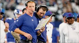  ?? Michael Ainsworth / Associated Press ?? New York Giants offensive coordinato­r Jason Garrett was fired after the team’s lackluster performanc­e in Monday’s 30-10 loss to the Tampa Bay Buccaneers.