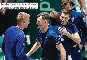  ??  ?? Decider: Jamie Murray (centre) and Skupski celebrate their doubles win