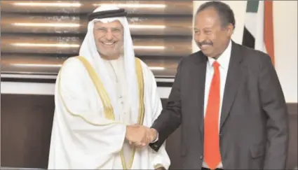  ?? -AP ?? UAE Minister of State for Foreign Affairs Anwar Gargash and Sudanese Premier Abdalla Hamdok.