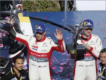  ??  ?? Kris Meeke and Paul Nagle lift their trophies to celebrate the third position during Day Four of the FIA World Rally Championsh­ip Mexico 2018 Photo by Leopoldo Smith Murillo / Getty Images