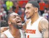  ?? Aaron Doster The Associated Press ?? Dayton’s Trey Landers, left, celebrates with Obi Toppin after Toppin scored his 1,000th career point in a Feb. 22 game.