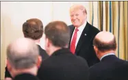  ?? Mandel Ngan / AFP/Getty Images ?? President Donald Trump arrives for a meeting with state governors in the State Dining Room of the White House on Monday in Washington.