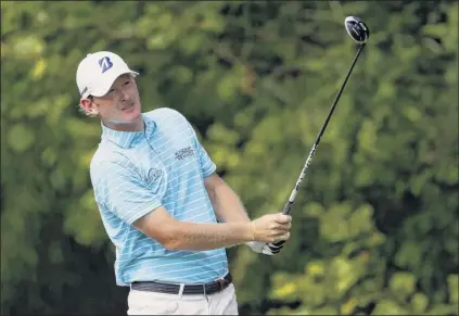  ?? Kevin C. Cox / Getty Images ?? Brandt Snedeker plays his shot from the 13th tee during the second round of the Wyndham Championsh­ip at Sedgefield Country Club on Friday in Greensboro, North Carolina. He takes a twostroke lead into the weekend at 14-under 126, the best two-round score at this tournament in 10 years.