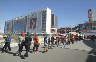  ?? Jeff Chiu / Associated Press 2016 ?? Fans enter Levi’s Stadium in Santa Clara for a 49ers game in October. The city says the team hasn’t provided all required documents on stadium operations; the team contends it has.