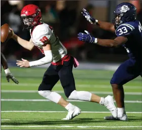  ?? (Arkansas Democrat-Gazette/Thomas Metthe) ?? Little Rock Christian defensive lineman Titus Colquitt (right) chases Maumelle quarterbac­k Weston Pierce during their game Friday in Little Rock. Colquitt said he felt compelled to play that night in honor of his father, Eddie Colquitt, who died two days earlier.