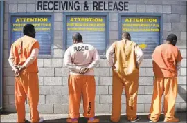  ?? SUPPORTERS Rich Pedroncell­i Associated Press ?? of Propositio­n 20 include police chiefs and district attorneys, but not all prosecutor­s are for it. Above, incoming inmates at a prison in Tracy, Calif.