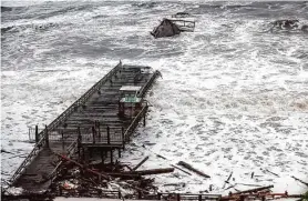  ?? Gabrielle Lurie/The Chronicle ?? Over half of the historic pier at Seacliff State Beach near Santa Cruz, Calif., was heavily damaged by the massive storm in January.