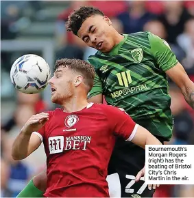  ?? ?? Bournemout­h’s Morgan Rogers (right) has the beating of Bristol City’s Chris Martin in the air.