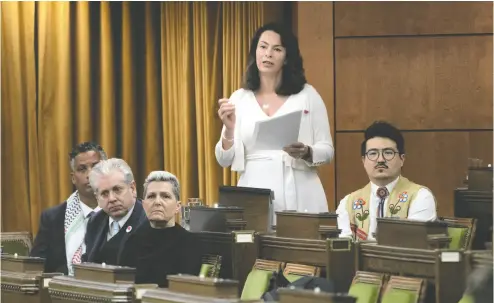  ?? ADRIAN WYLD / THE CANADIAN PRESS ?? NDP MP Heather Mcpherson rises to introduce a motion on the situation in the Middle East on Monday.