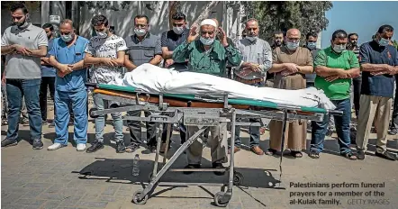  ?? GETTY IMAGES ?? Palestinia­ns perform funeral prayers for a member of the al-Kulak family.