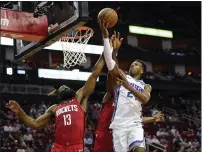  ??  ?? Sacramento Kings’ Buddy Hield goes up for a shot as Houston Rockets’ James Harden defends during the first half Monday.