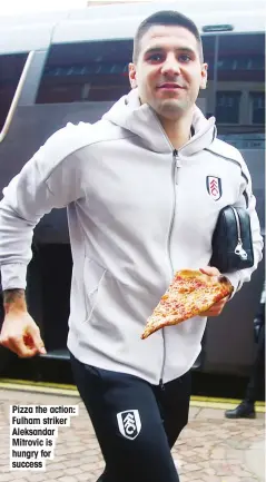  ??  ?? Pizza the action: Fulham striker Aleksandar Mitrovic is hungry for success