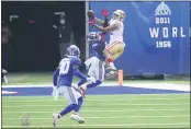  ?? COREY SIPKIN — THE ASSOCIATED PRESS ?? The San Francisco 49ers’ Jordan Reed, right, tries to grab a pass over the New York Giants’ Logan Ryan during the first half Sunday in East Rutherford, N.J.